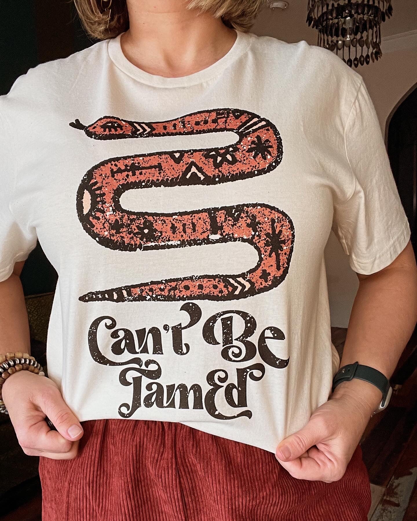 CAN'T BE TAMED TEE